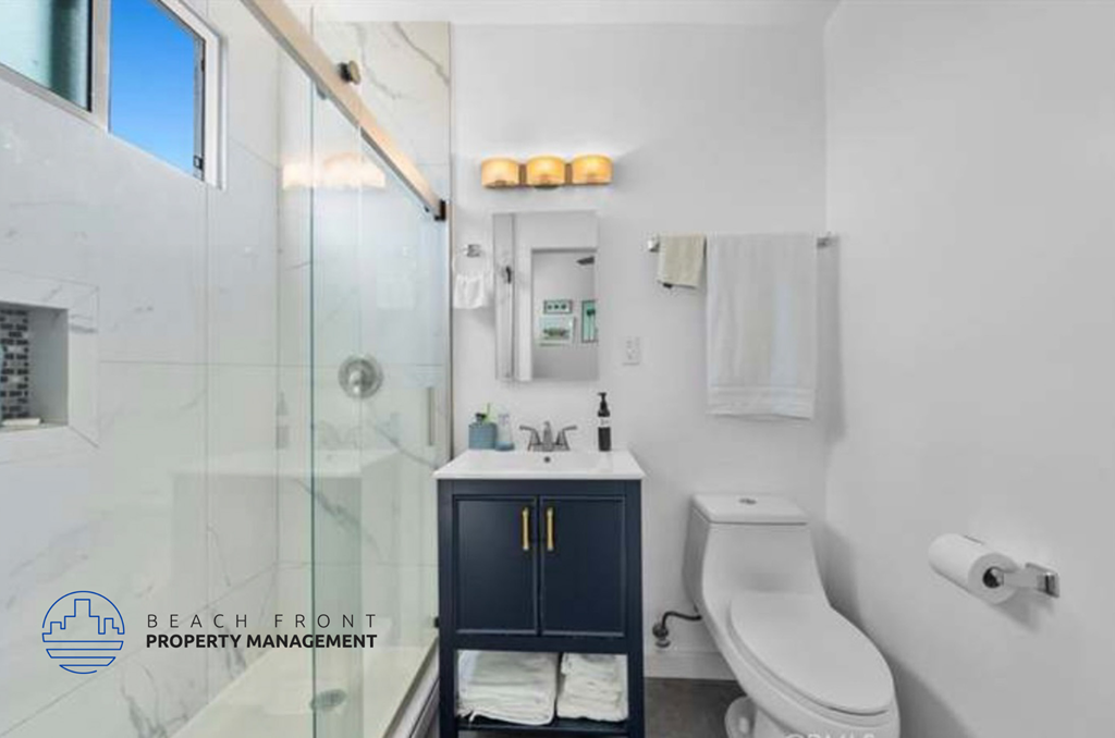 a bathroom with a sink toilet and a shower