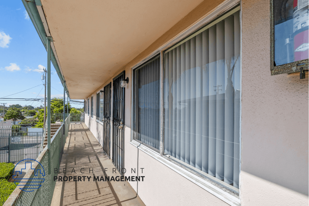 a view of the outside of a building with windows and a balcony