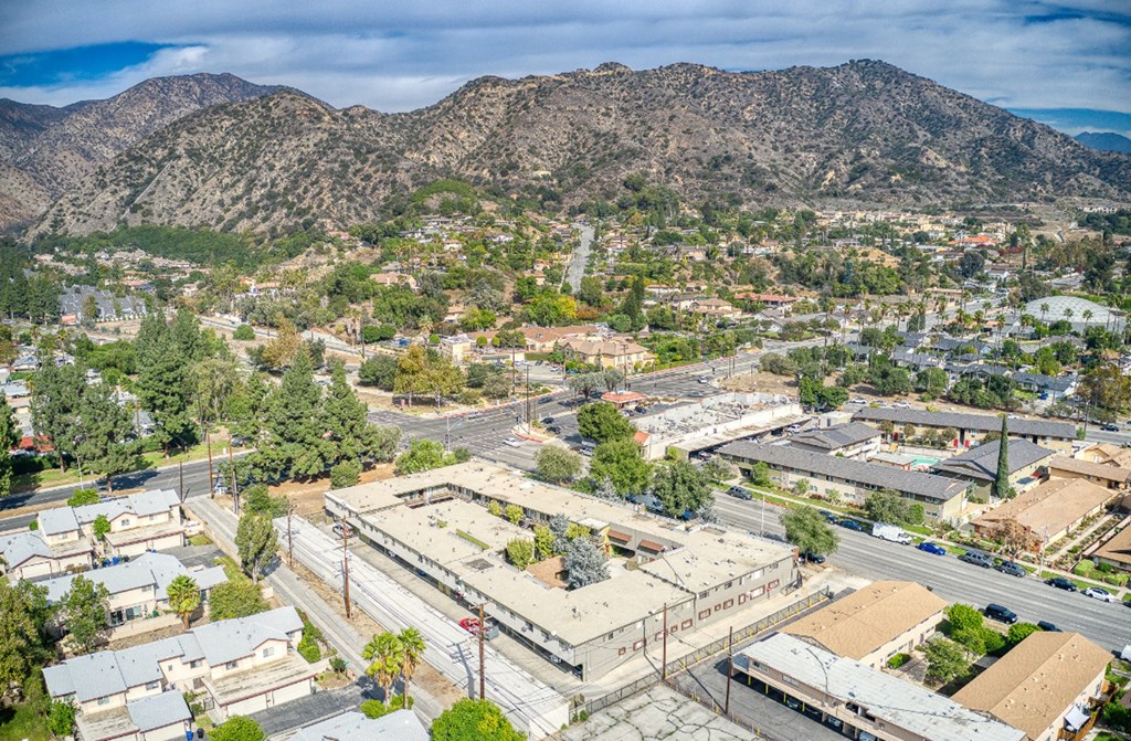 an aerial view of the city of palm springs and the mountains