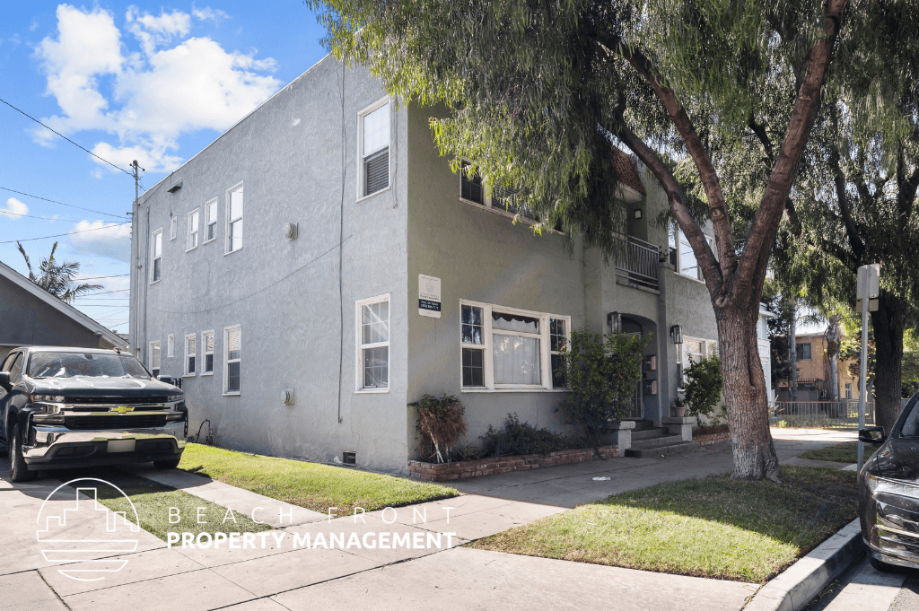 an apartment building with a truck parked in front of it