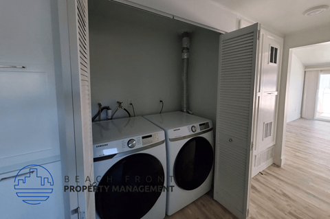 a washer and dryer in a laundry room with a closet