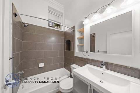 a bathroom with a sink and a mirror and a toilet