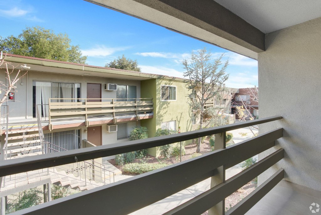 the view from the balcony of an apartment building
