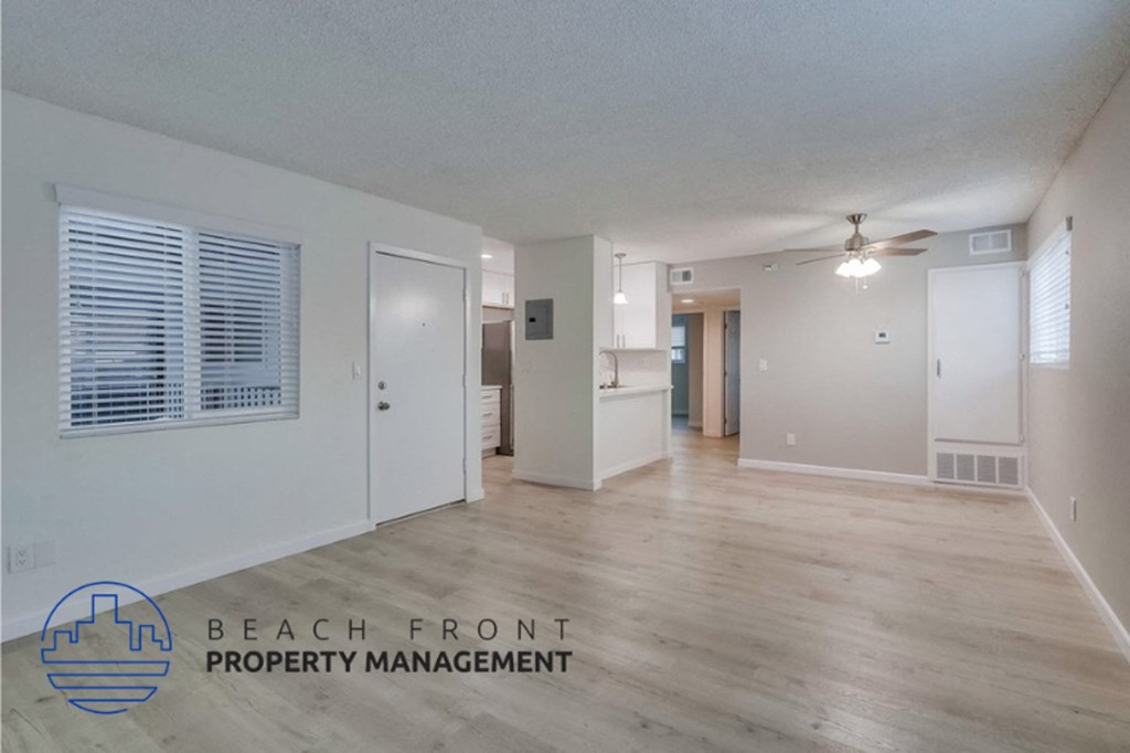 the living room and dining room are open to the hallway and kitchen