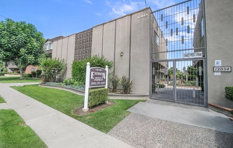 The image shows a building with a sign that reads