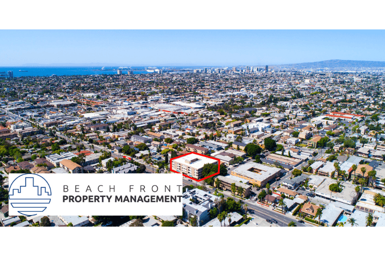 a view of the city with the beach from property management logo