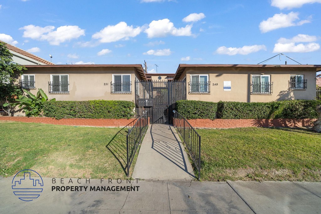 A building with the words Beach Front Property Management on the bottom left.