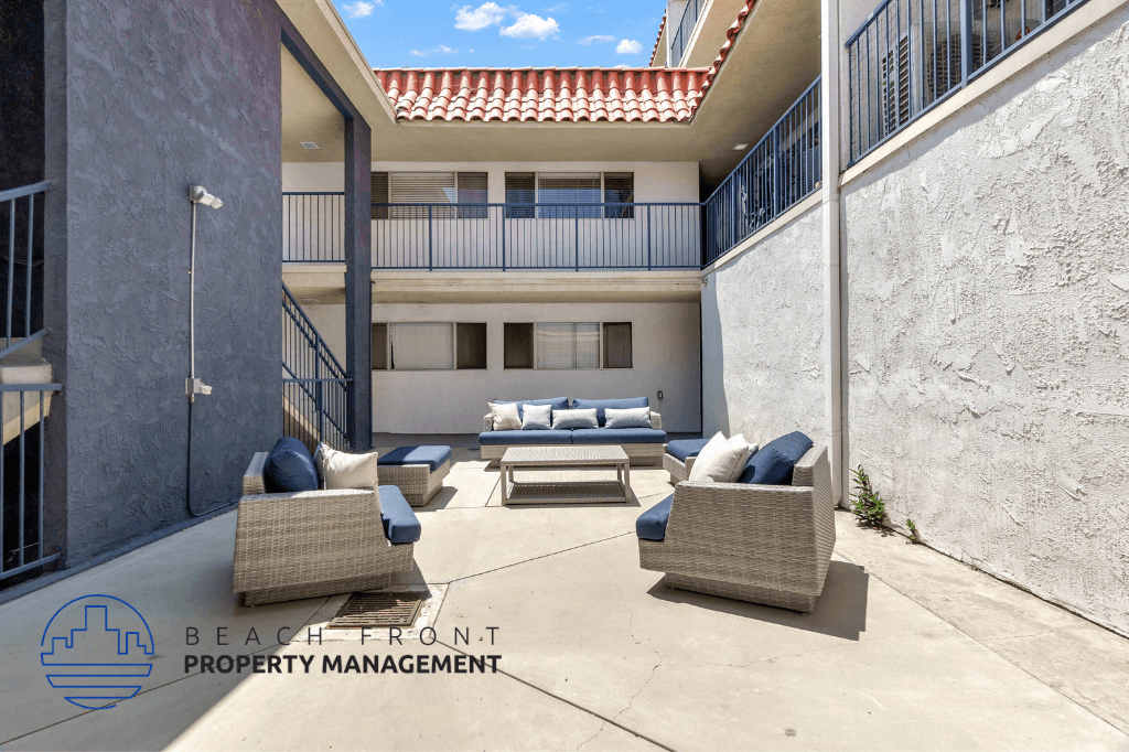 a patio with couches and chairs and a table