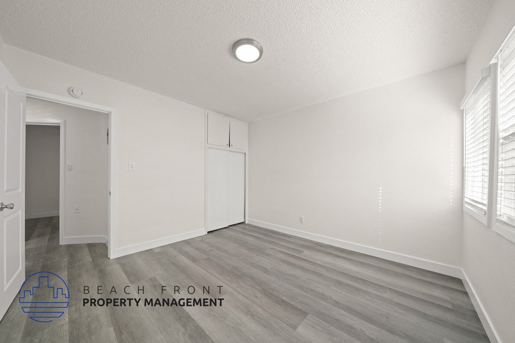 A room with a logo for Beach Front Property Management.