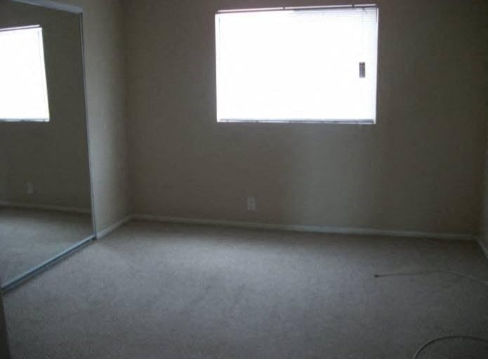 an empty room with a window in it