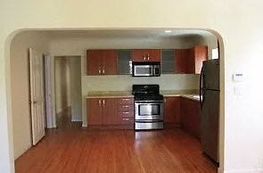 a kitchen with a stove and a refrigerator