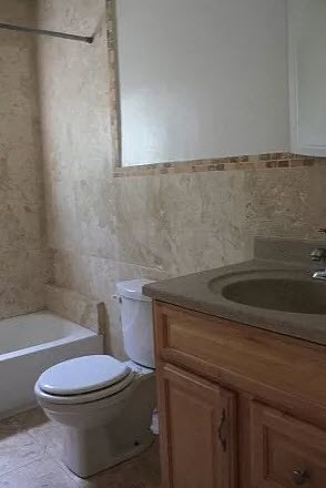 a bathroom with a toilet and a sink