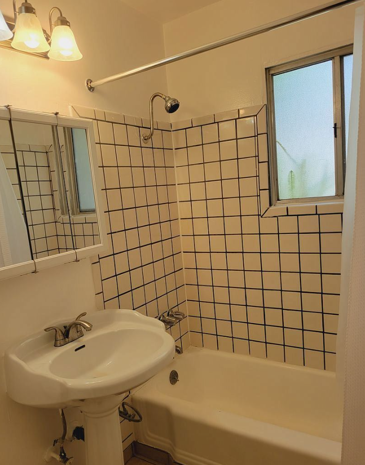 a bathroom with a sink and a bath tub