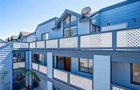 a blue building with a satellite dish on top of it