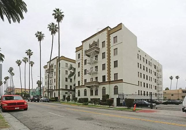 a large white building on the side of a street