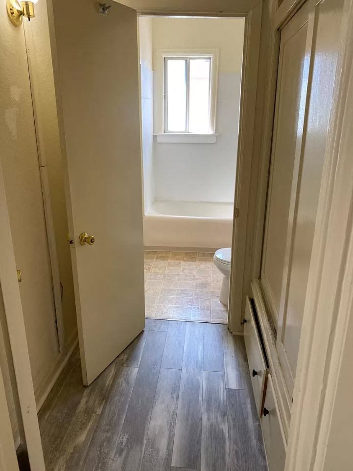 a small bathroom with a toilet and a window