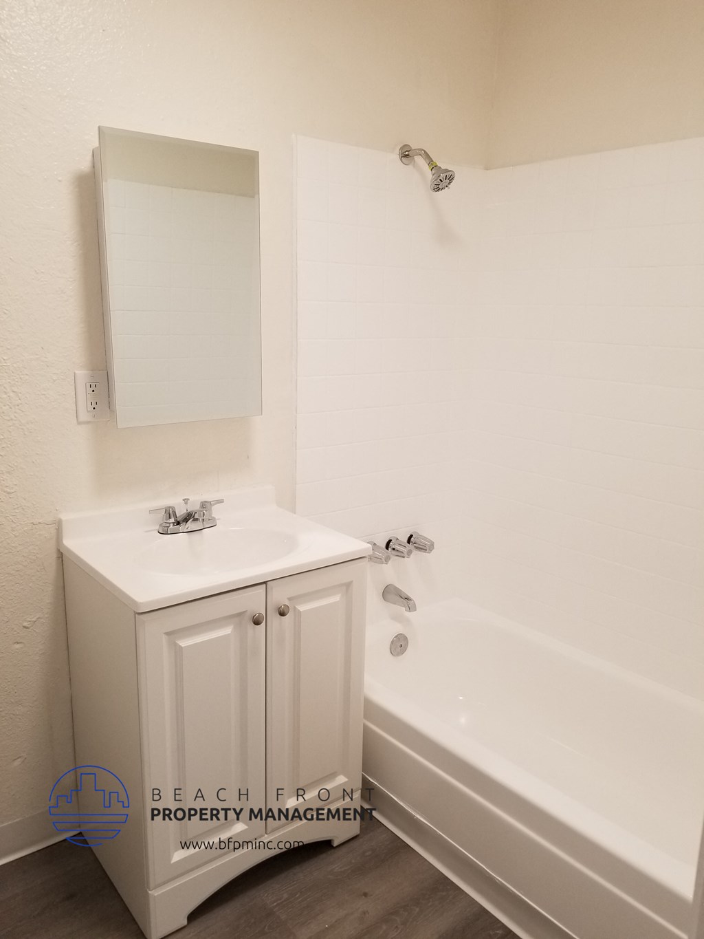 the bathroom of a small bathroom with a sink and a tub