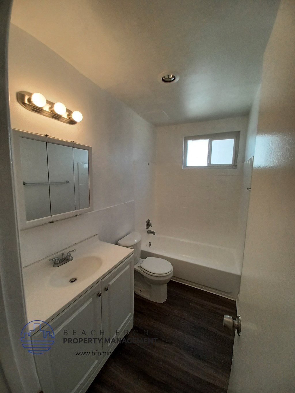 a small bathroom with a toilet sink and bathtub