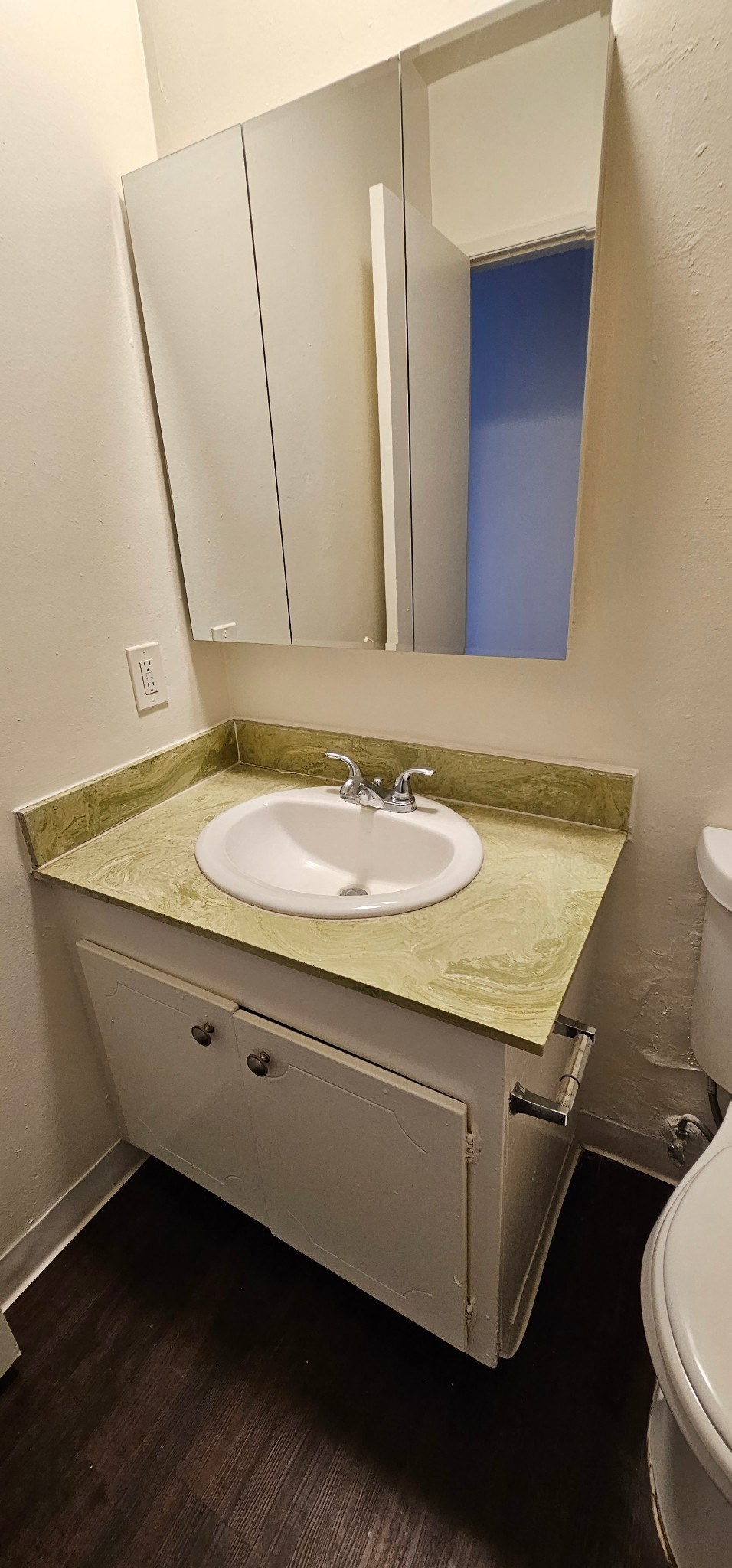 a bathroom with a sink and a mirror