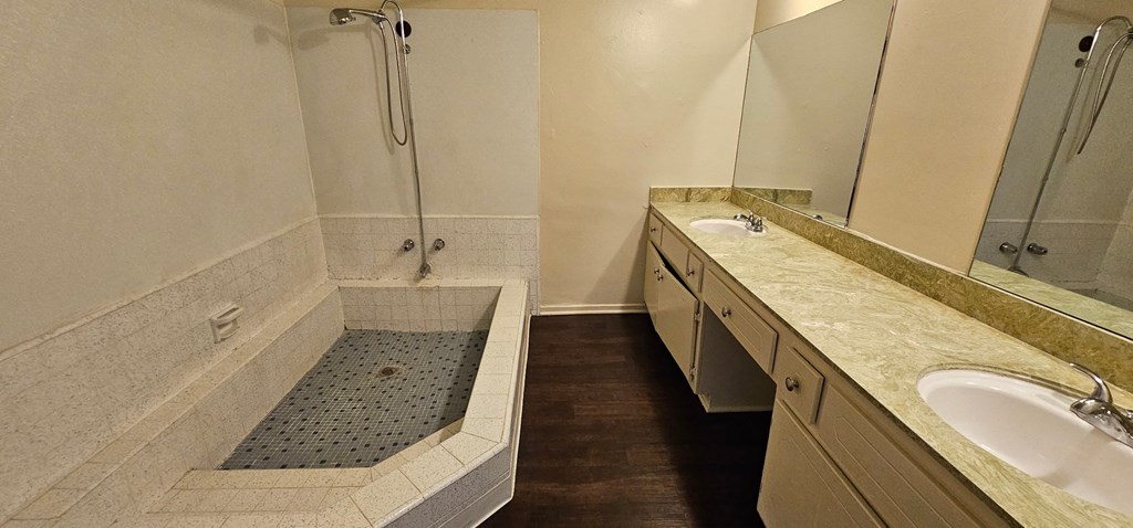 a bathroom with a bathtub and a sink
