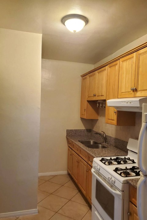 a kitchen with a stove and a sink