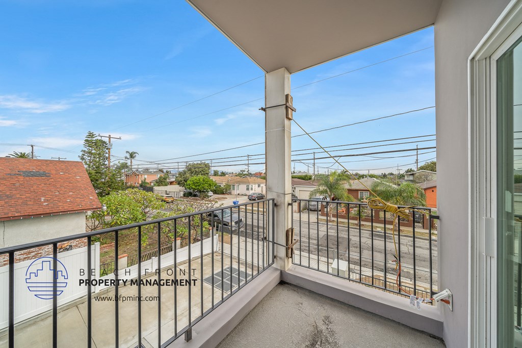 a balcony with a view of the train tracks