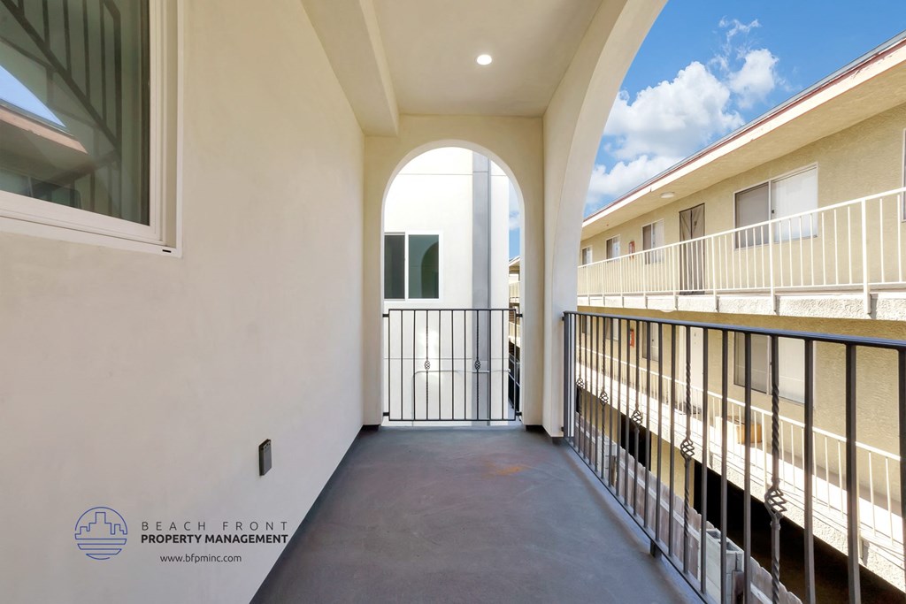 a view of a balcony in a building with a balcony guard rail
