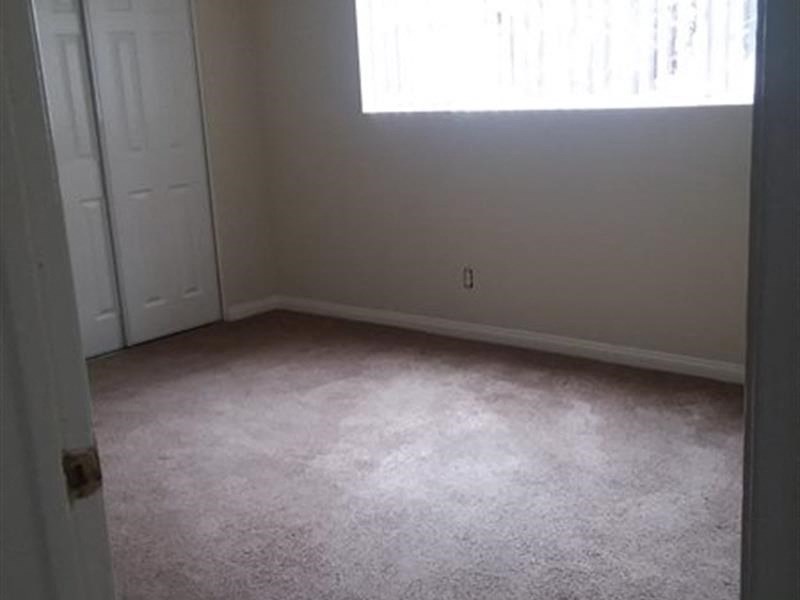 a small room with a window and a door