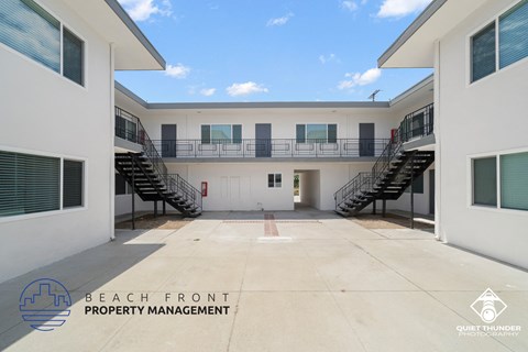 a large building with two sets of stairs in front of it