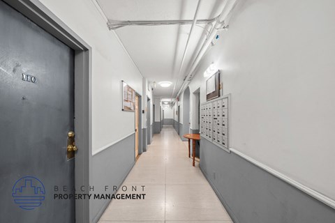 a long corridor with doors to the rooms in the building
