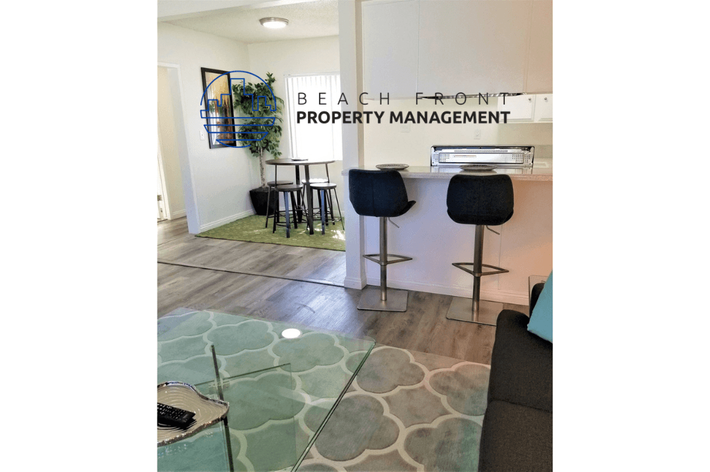 a living room with a bar and a table with chairs
