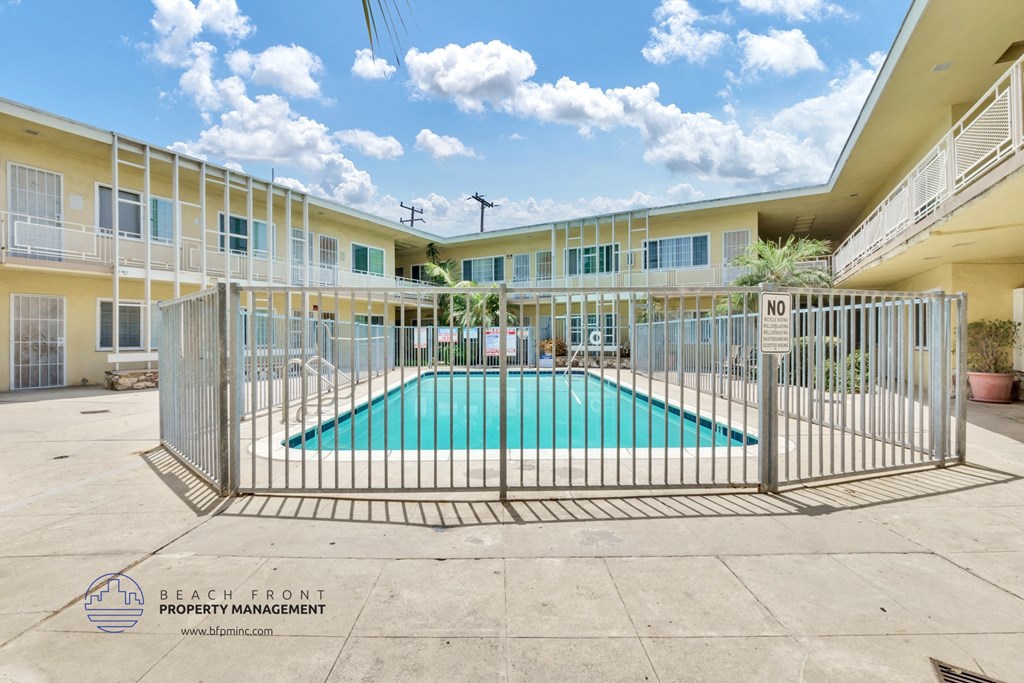 a fenced in swimming pool at the enclave at woodbridge apartments in sugar land
