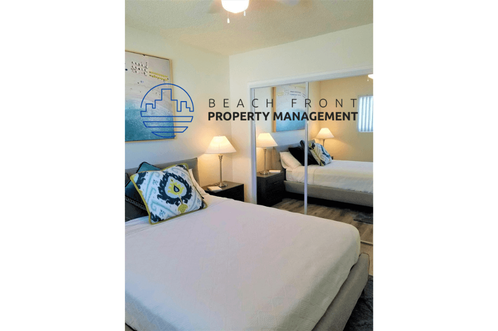 a bedroom with two beds and a sign for beach front property management