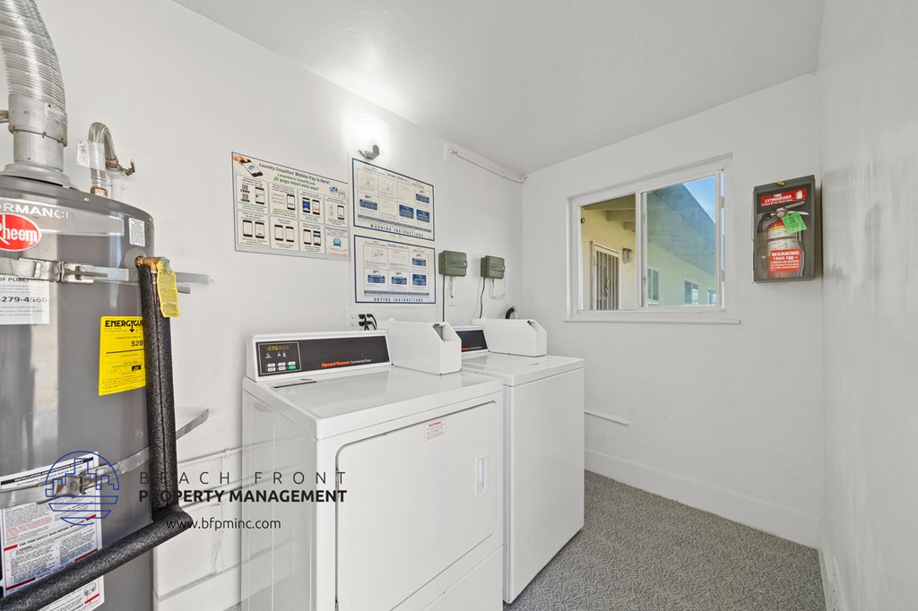 a laundry room with a washer and dryer