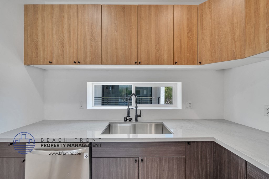 a kitchen with a sink and a window
