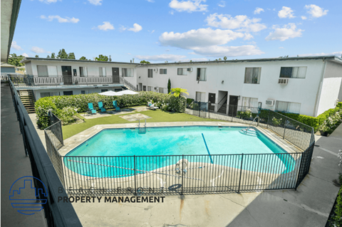 a view of a swimming pool in front of a building