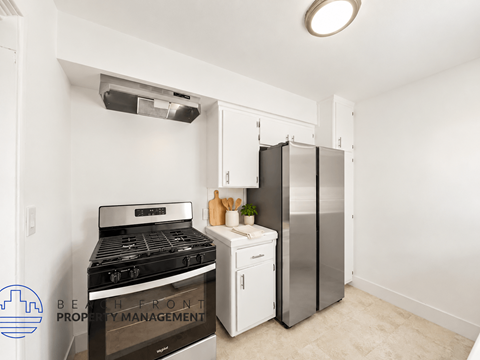 A kitchen with a stove, oven, and refrigerator.