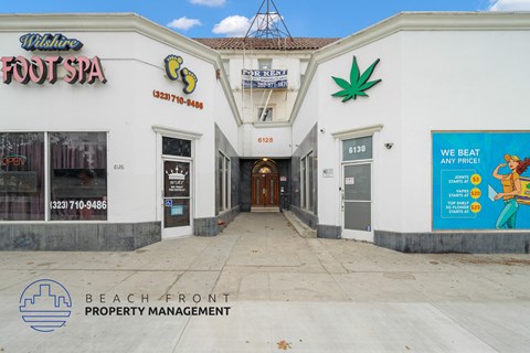 the facade of the beach front property management office at the beachfront property management building
