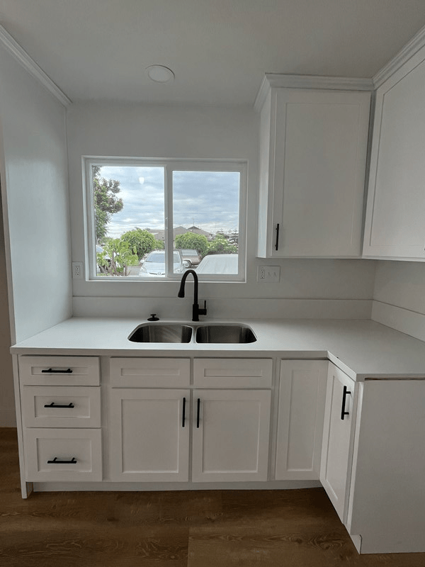 a kitchen with a sink and a window
