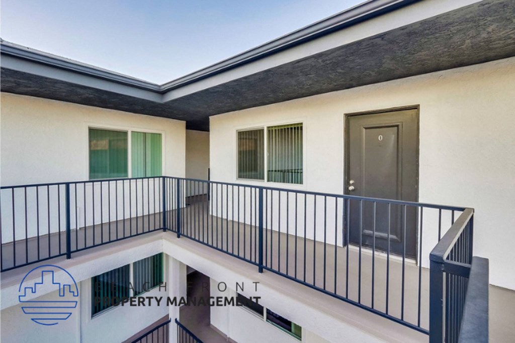 a view of a balcony of a building with a door