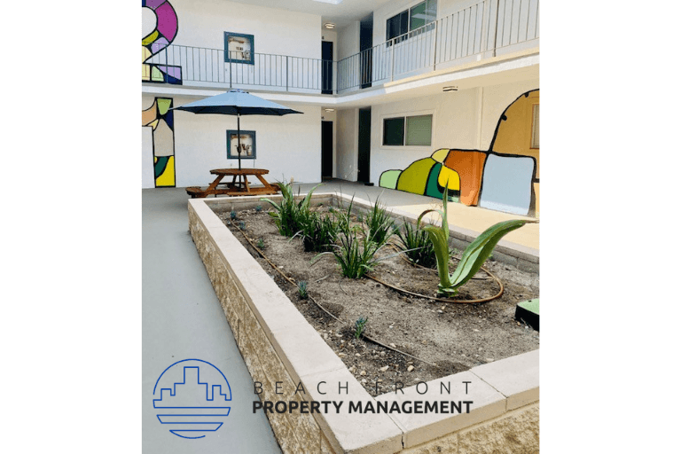 a beachfront property management office with a patio with plants