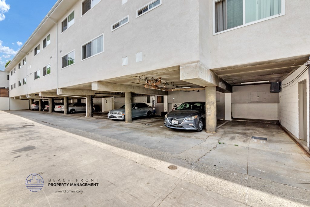 a parking garage with two cars in it