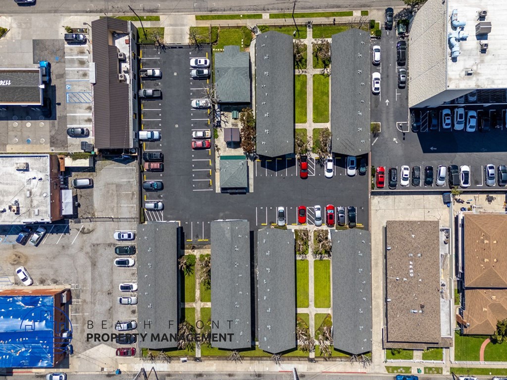 a birds eye view of a parking lot with cars on it