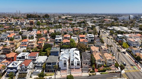 A bird's eye view of a residential area with houses and streets.