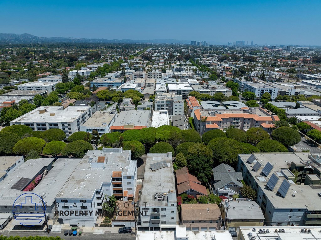 A bird's eye view of a city with a building that says "Real Estate Property Management".
