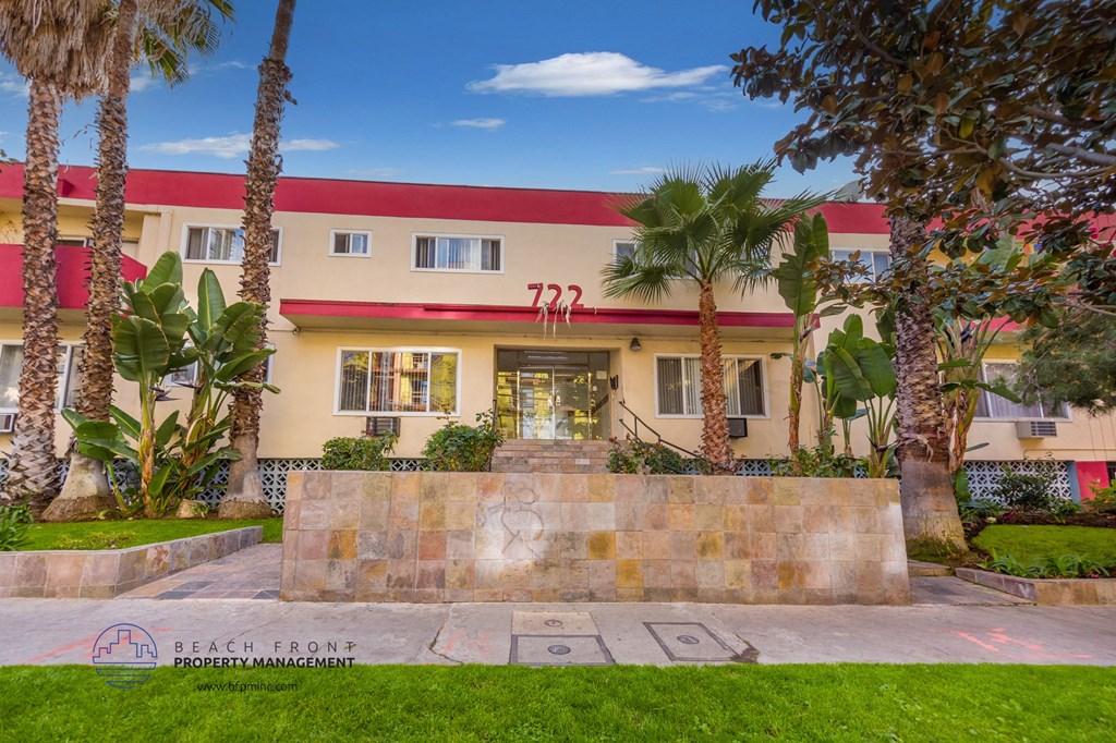 a building with palm trees in front of it