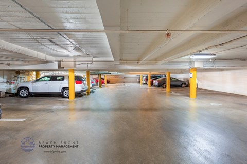 a parking garage with cars parked in it