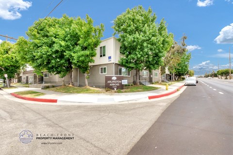 a roundabout in front of an apartment building on a city street