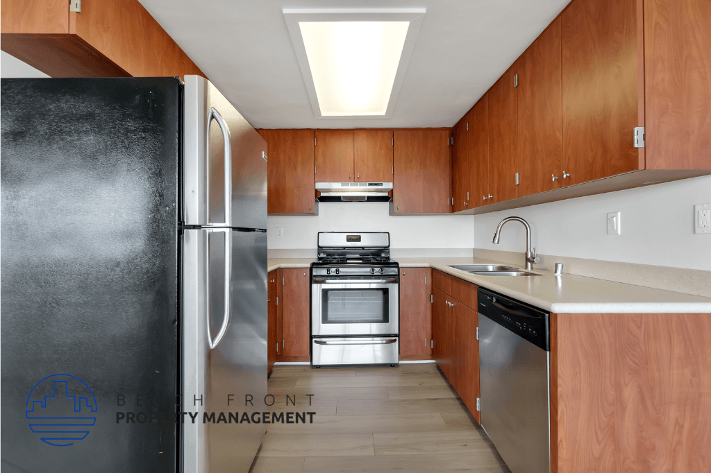 a kitchen with wooden cabinets and stainless steel appliances