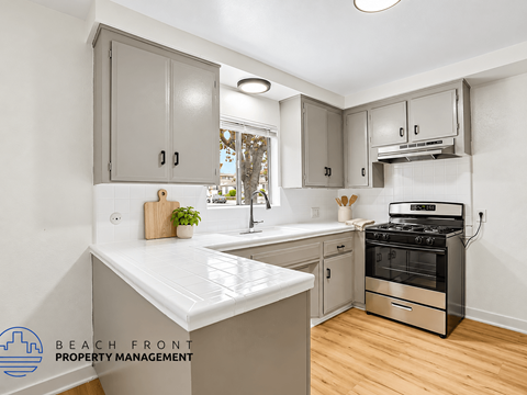 A kitchen with a stove and a countertop.